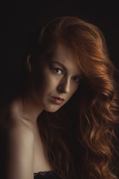 Closeup portrait of young beautiful model at studio
