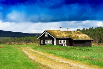 Fototapeta na wymiar Classic Norway cottage landscape background
