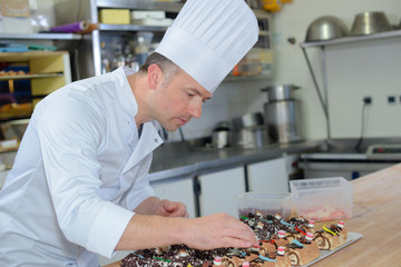 chef preparing the small cakes