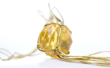 necklace with cheap plastic gems with golden colored rope