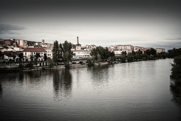 Zamora skyline at sunset by Duero river Spain