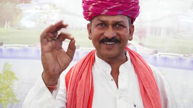 MS Rajasthan male in making satisfied hand gestures and wishing a thumbs up