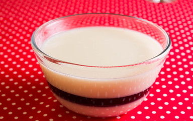 Panna cotta with strawberry jam in a glass