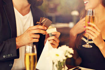 Young man proposing to beautiful woman