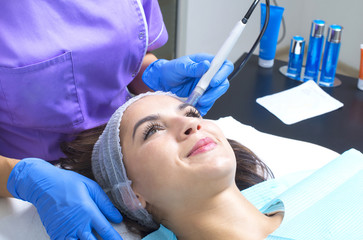 Picture of woman having facial treatment in beauty salon