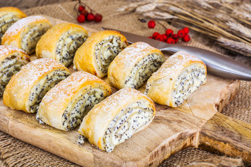 Homemade cakes, puff buns with cottage cheese and poppy seeds