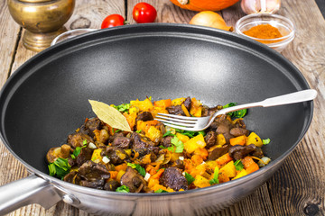 Vegetable stew with pumpkin, celery and mushrooms