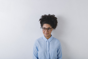 Fototapeta na wymiar A young woman wearing glasses, copy space
