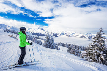 Fototapeta na wymiar Young woman skiing in Kitzbühel ski resort in Tyrolian Alps, Austria