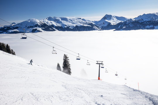 Chairlift and ski slopes in Kitzbühel ski resort in Tyrolian Alps, Austria