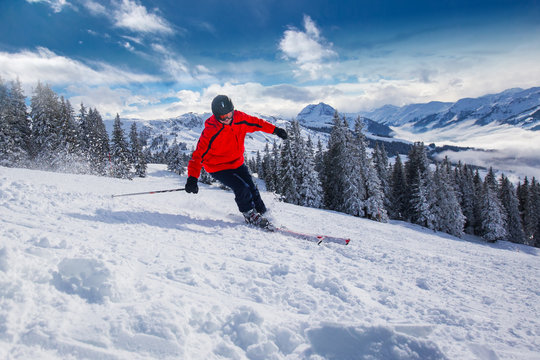 Young man skiing in Kitzbühel ski resort, Tyrol, Austria
