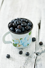 blueberry on wooden surface