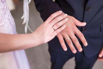 Obraz na płótnie Canvas hands with wedding rings