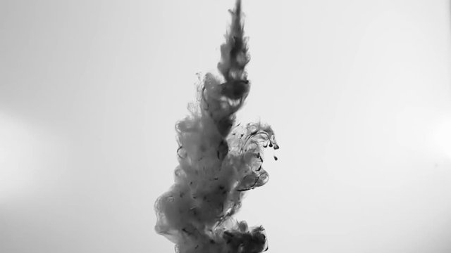 Dirty Lumpy Ink In Water On White Background