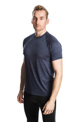 Obraz premium Blonde man wearing workout clothing standing against a white background staring at camera.