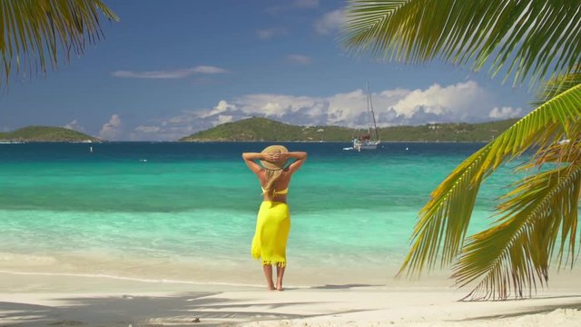 woman standing on tropical beach in the caribbean, St John