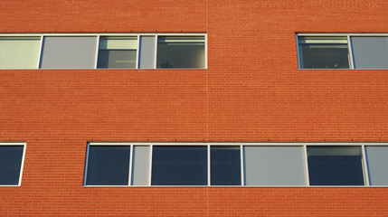 brick wall office building horizontal windows business facade