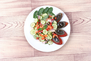 Spicy cucumber salad with dried shrimp and  preserved egg.