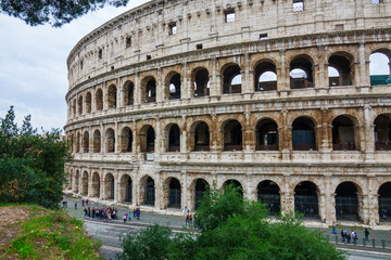 Fototapeta na wymiar The famous Colosseum in Rome - Colisseo - a huge tourist attraction in the city