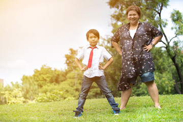 Fototapeta premium Happy Asian family ,mother with her son at park