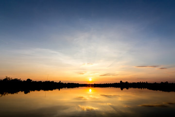 Naklejka na ściany i meble sky at sunset on the lake