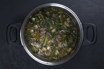curry chicken in pot on dark background, thai food
