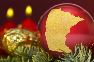 Red bauble with the golden shape of Minnesota.(series)