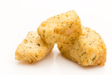 Salad Croutons in a stack on a white background.