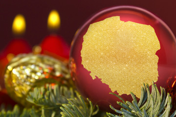 Red bauble with the golden shape of Poland.(series)