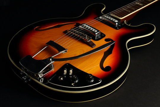 Hollow Body Guitar on Black Background