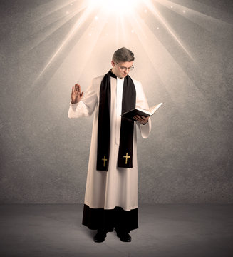 young priest in giving his blessing