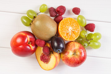 Fresh ripe fruits on white boards, healthy nutrition