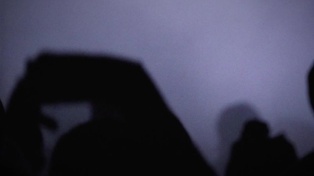 Hands Moving in Slow Motion Above the Raving Crowd in the Night Club