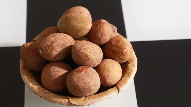 fruit lychee tree in an ecological plate of leaves on a table