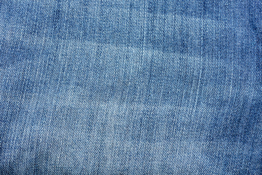 Close up image of blue denim jeans background or texture.