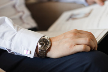 clock on a male hand