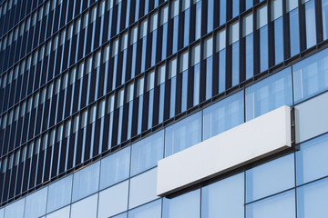 square empty signboard on a building with modern architecture