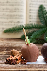 Glazed in chocolate apple for christmas and music sheet
