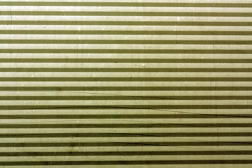 Obraz premium Corrugated yellow metal plate surface.