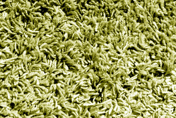 Yellow color carpet surface.