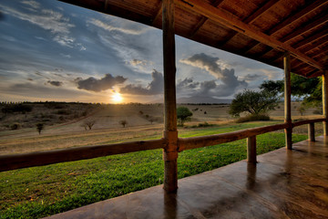 Amazing view from a wooden porch of a luxury lodge in Tanzania - obrazy, fototapety, plakaty
