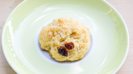 rock cake in a yellow plate on a wooden background.