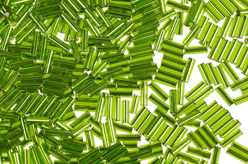 Green glass beads background - closeup beads texture