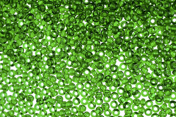 Green glass beads background - closeup beads texture
