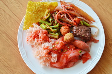large noodle with fish and shrimp ball dress red soy sauce