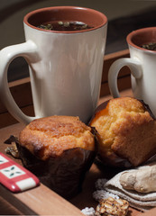 breakfast in bed include tea, cookies, cupcake, honey and sweets
