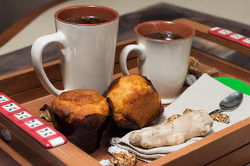 breakfast in bed include tea, cookies, cupcake, honey and sweets