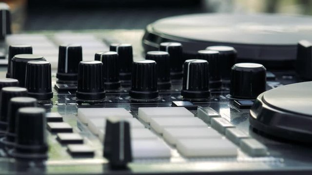 dj mixing music on dj pult - sound equalizer - detail