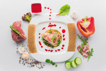 dish of veal with red pepper, meat rolls, fresh mushrooms