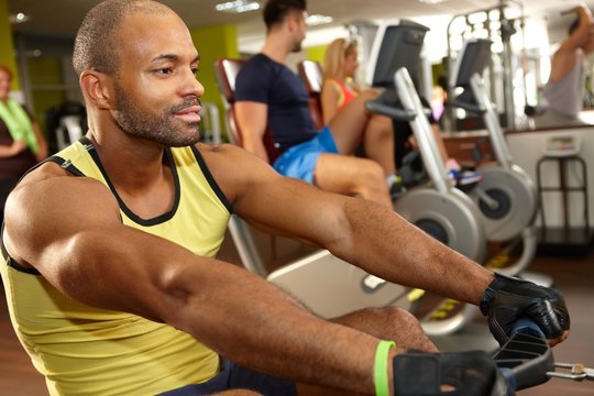 Black Man Training On Rowing Machine